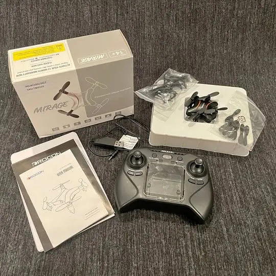 Foldable mini drone kit with controller and spare propellers, in packaging