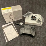 Foldable mini drone kit with controller and spare propellers, in packaging
