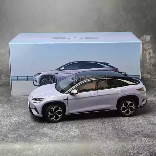 1/18 scale diecast car model with silver body and black wheels, front 3/4 view