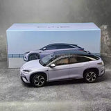 1/18 scale diecast car model with silver body and black wheels, front 3/4 view