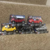 Boxed 1:36 diecast model car set with assorted red, yellow, blue, and silver cars