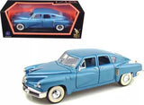 Light blue 1948 Tucker Torpedo diecast model car with whitewall tires