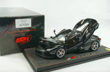 Black diecast Ferrari LaFerrari model car with open parts, on display base