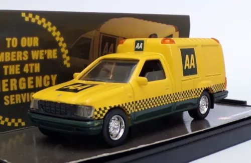 Yellow diecast van model with AA logos, front three-quarter view, black grille and wheels