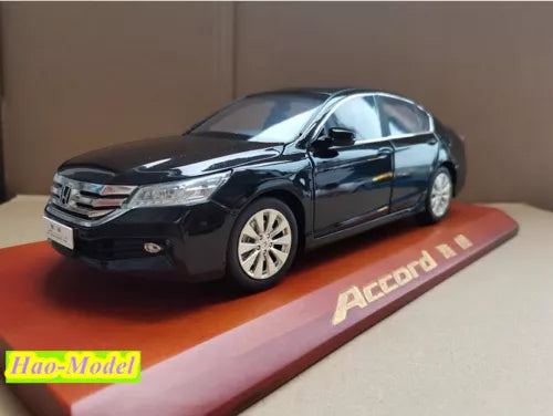Black die-cast Honda Accord 9th Gen model car with wheels, on display base