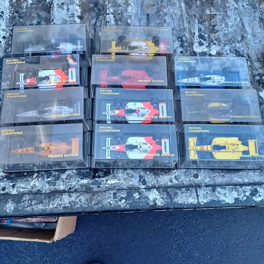 Diecast Indy car models in clear boxes, Racing Champions Premier Edition