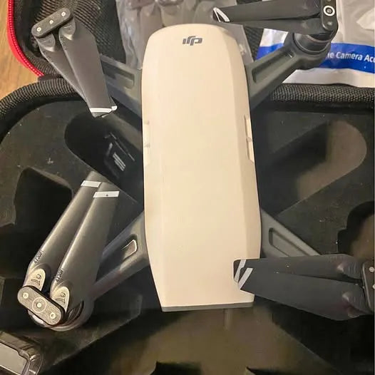 White drone body with arms and prop guards