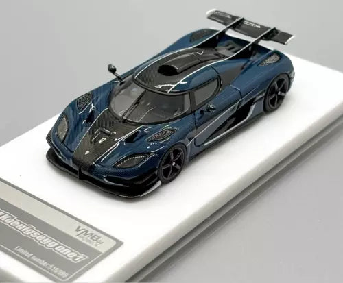 Blue racing sports diecast car model with black hood and front aero detail, 1:64 scale