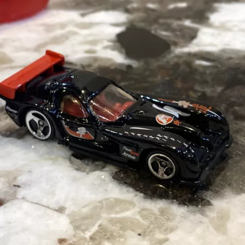 Hot Wheels black and red Panoz GTR-1 diecast car, 1:64 scale, sporty race-style decals