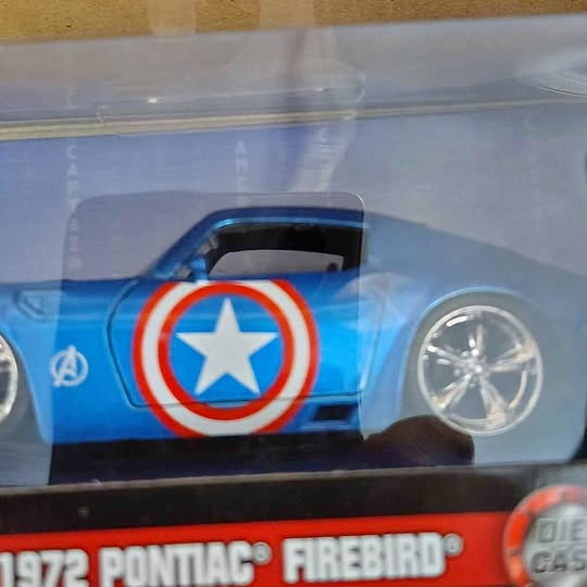 Blue diecast race car in clear box with Captain America shield graphics