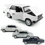 White 1/32 diecast model car, side and front view with doors open