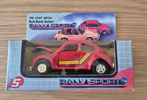 Red Volkswagen Beetle cabriolet diecast toy car in window box with detailed graphics
