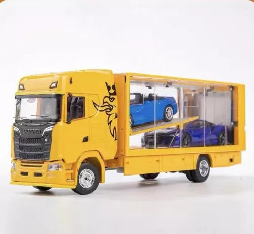 Yellow diecast transport truck with open side showing a blue car inside