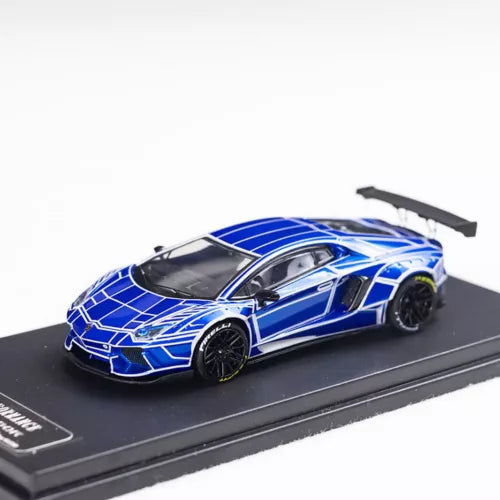 Blue and white Lamborghini diecast car model with black wheels, on display base
