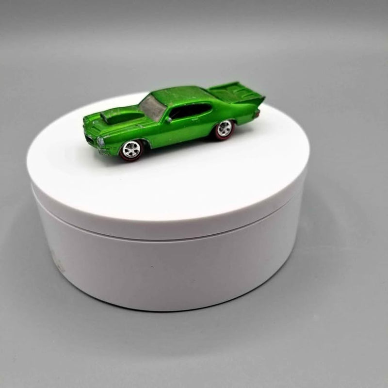 Diecast model car of a 1971 Pontiac GTO in green