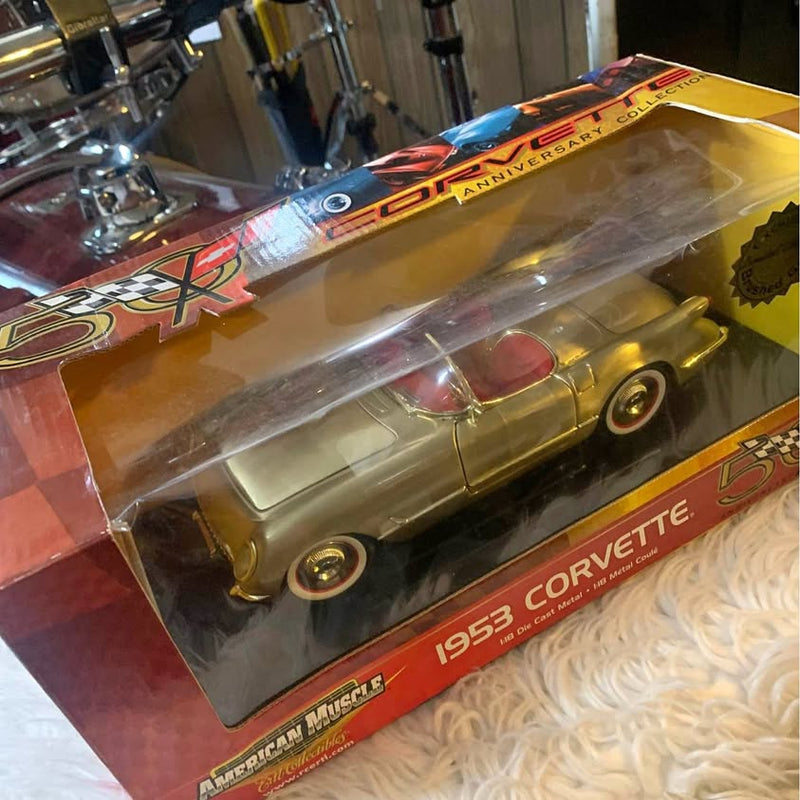 Gold 1953 Corvette diecast car in clear display box, collectible model
