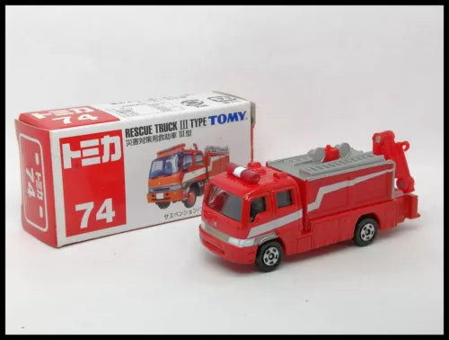 Red rescue truck diecast toy with printed packaging box, front three-quarter view