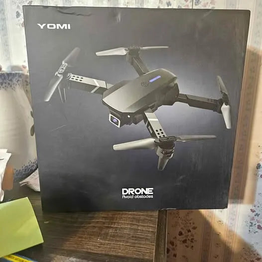Drone box with YOMI branding and illustrated quadcopter