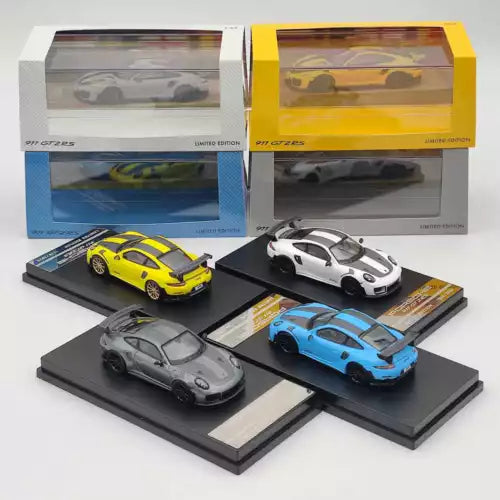 Diecast toy car models collection with yellow, white, gray and blue cars on bases