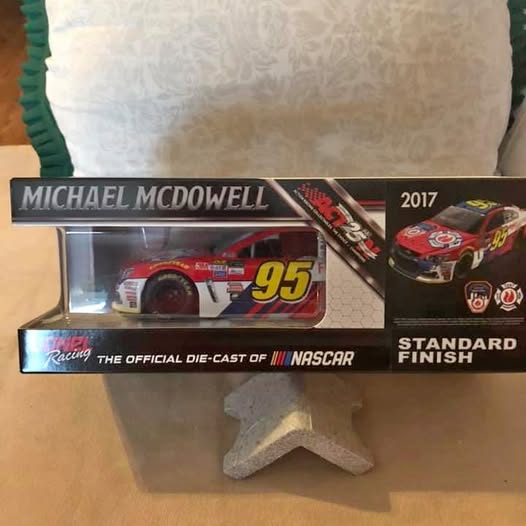 Red #95 diecast NASCAR race car in clear display box, Michael McDowell 2017