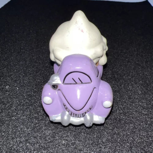 Purple and white diecast toy truck scoop head with smiling face
