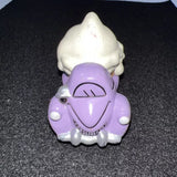Purple and white diecast toy truck scoop head with smiling face