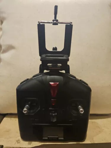 Black handheld drone remote controller with two joysticks and antenna mast