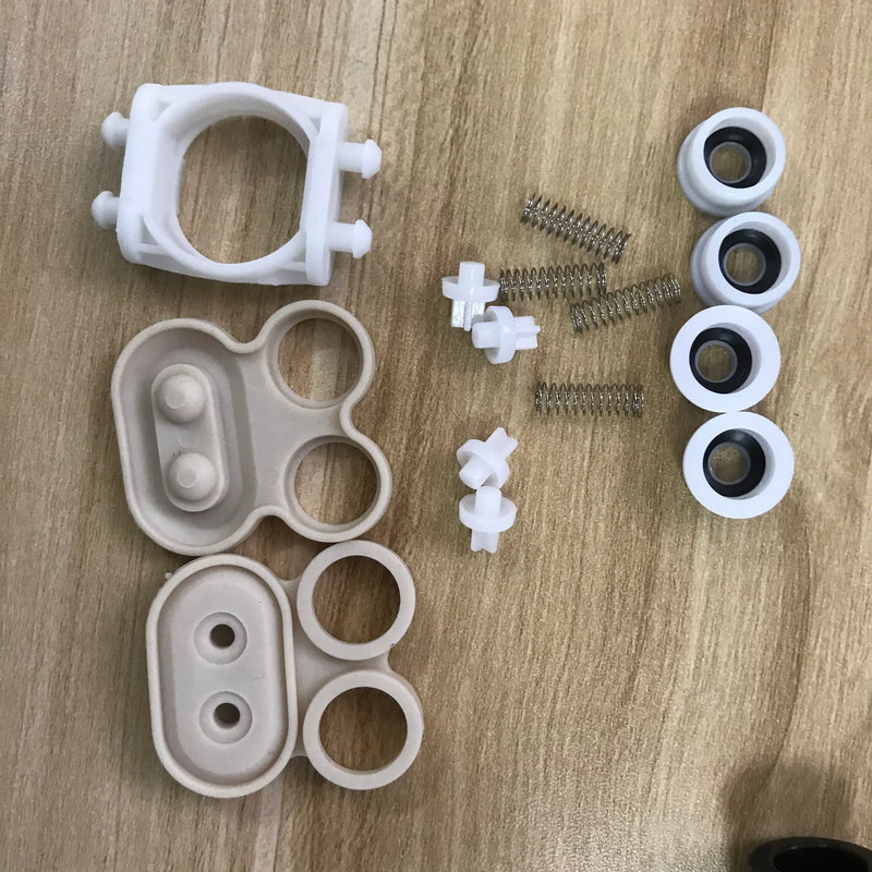 12V small water pump repair kit parts with white housings, rings, seals, springs, fittings