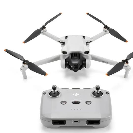 DJI Mini 3 drone with camera gimbal and four propellers, with remote controller