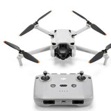 DJI Mini 3 drone with camera gimbal and four propellers, with remote controller