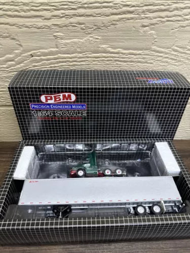 1/64 diecast Freightliner truck in PEM box with Wilson Trucking branding, open packaging.