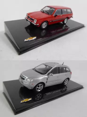 Set of 2 diecast cars, 1:43: red and silver-gray models on display bases