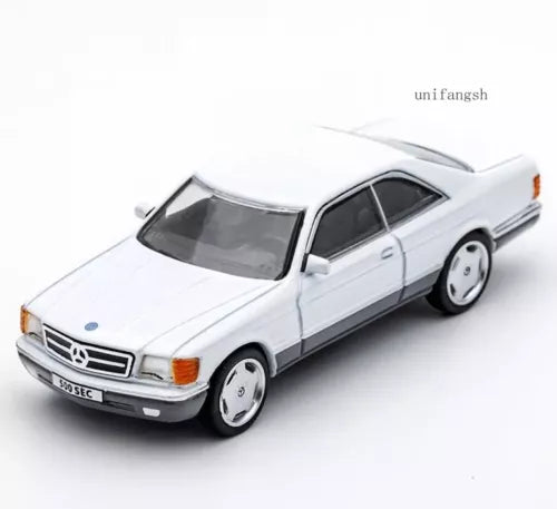 White classic coupe diecast car toy with front 3/4 view, chrome wheels and grille
