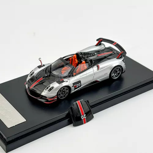 1:64 silver Huayra roadster diecast model car with black hood and orange accents