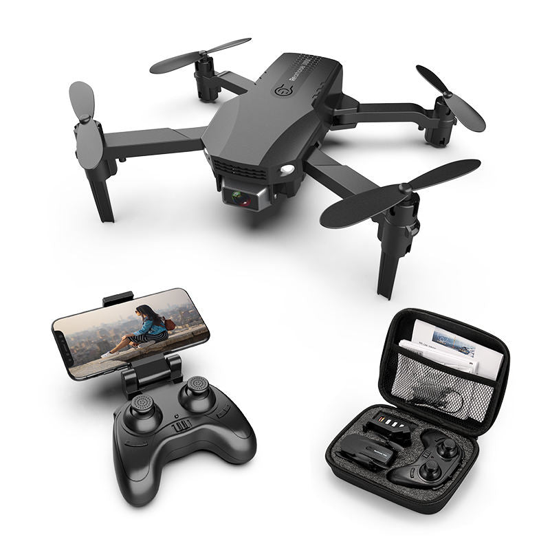 Foldable quadcopter drone with four propellers, remote controller and open carrying case