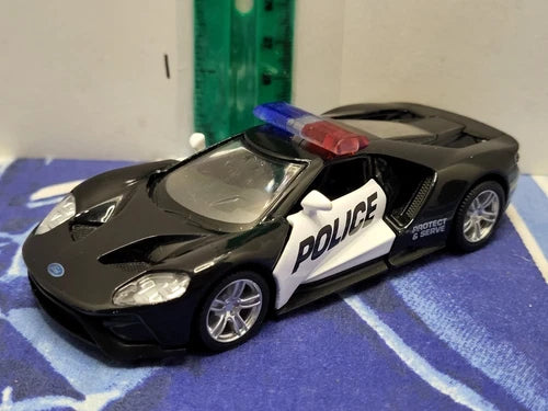 Black police diecast car with pull-back action, POLICE graphics and red roof light.