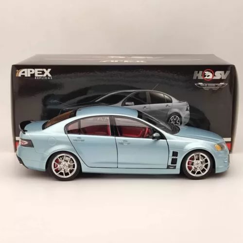 Diecast model car, light blue coupe with white wheels, front and side view