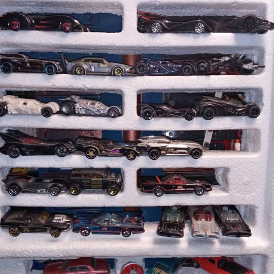 Batman 1/64 diecast car set in tray, multiple black and gold models