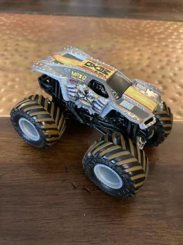 Hot Wheels Monster Jam monster truck diecast, gray and blue with large tread tires