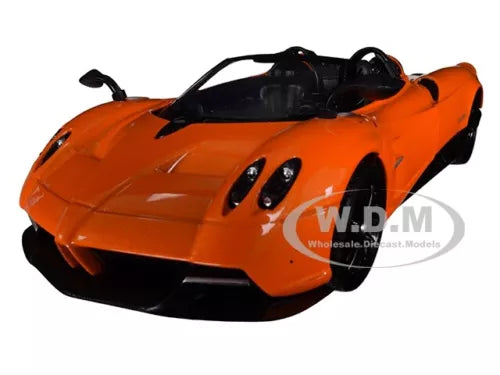 Orange open-top roadster diecast model car with black hood and side accents