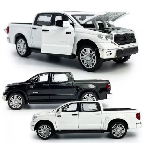 Metal diecast pickup truck toy with open doors, white and black views