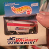 White diecast car with red stripe and JC Whitney Warshawski branding, in box