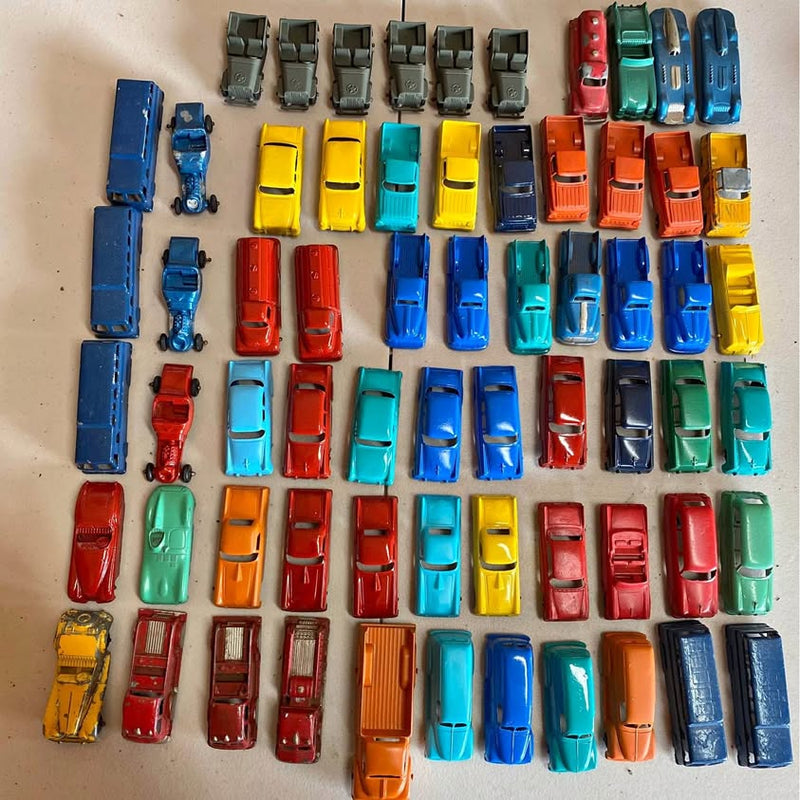 Assorted diecast Matchbox-style toy cars, many colors and models