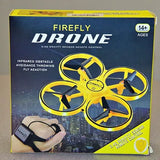 Yellow quadcopter drone with four propellers shown on retail box