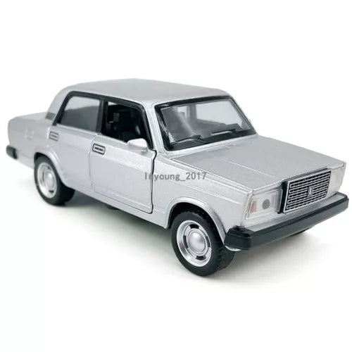 Silver 1:32 diecast model sedan car with detailed grille and headlights