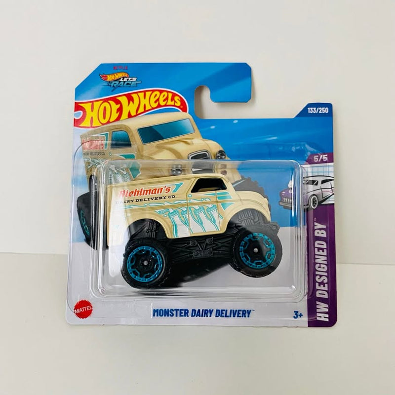Monster Dairy Delivery diecast truck on blue Hot Wheels card, cream with teal graphics