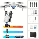 Foldable white quadcopter drone with blue LED front light, camera, and four propellers