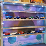 Diecast car display case with three shelves of assorted model cars