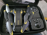 Foldable camera drone and remote controller in storage case