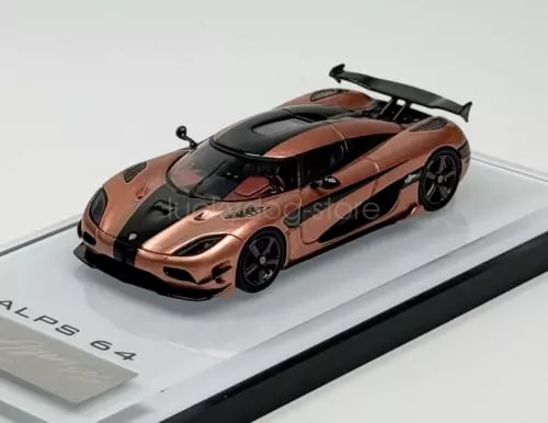 Orange and black race car diecast model with front grille and wheels